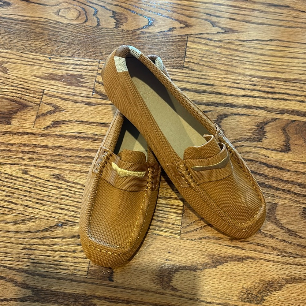 Never-worn women’s brown and gold loafers